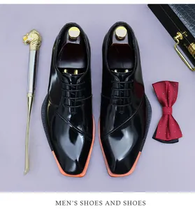 Polished black leather oxfords featuring a distinct orange sole and square toe design