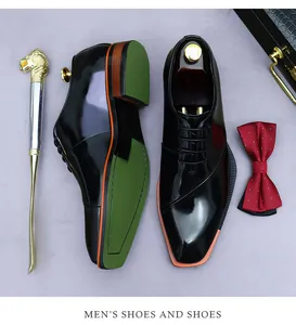 Close-up of black patent leather dress shoes with unique green sole and colorful midsole