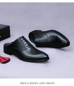 Macro detail of men's black leather mule shoes with lace-up oxford design and rich texture
