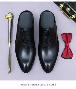 Top view of black leather dress mules featuring oxford laces and sleek pointed toe design