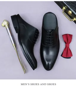Detail shot of black leather business mules with laces and luxury gentleman accessories