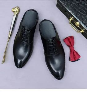 Detailed top view of black leather business mule with laces on an elegant purple background