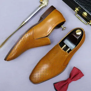 Men's hollow-out leather business shoes in light brown with laser-cut detailing