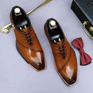 Brown gradient leather dress shoes with decorative stitching and formal accessories