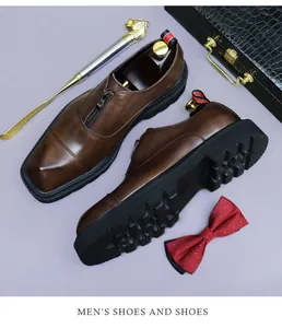 Detail of dark brown leather formal shoes featuring zip-up design and non-slip rubber sole