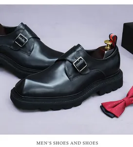 Detail of black leather monk strap shoe with silver buckle and thick lug sole