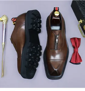 Top view of brown leather business shoes with metal zipper and chunky non-slip sole
