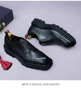 Detail view of premium black leather men's shoe with silver zipper and thick rubber sole