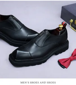 Close-up of premium black leather dress shoe with front zipper and platform sole
