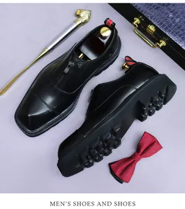 Detail of black leather dress shoes featuring front zipper and thick non-slip gear sole