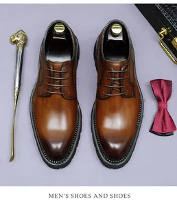 Close-up of brown leather Derby shoes with lion shoehorn and burgundy dotted bowtie