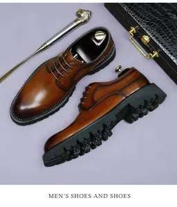 Detail of brown leather brogue shoes with classic wingtip perforation and thick lug soles