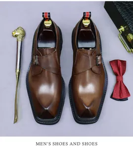 Brown leather monk strap shoes with classic metal buckle and formal business accessories