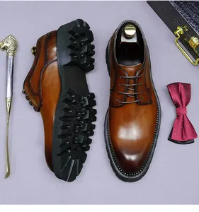 Detailed view of brown leather brogue shoes with classic wingtip carving and thick rubber sole