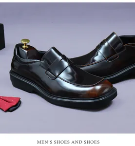 Macro shot of polished dark burgundy leather loafers with elegant wooden shoe trees and bowtie