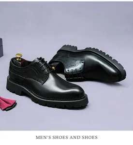 Detail of premium black leather Derby shoes with brogue patterns and non-slip rubber soles