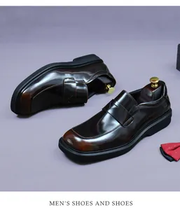 Detail view of glossy dark brown leather loafers with square toe and formal bowtie