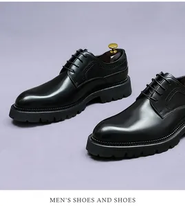 Detail of black leather derby shoes with brogue patterns and chunky lug soles