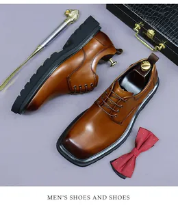 Close-up of brown leather men's dress shoes with square toe and thick rubber soles