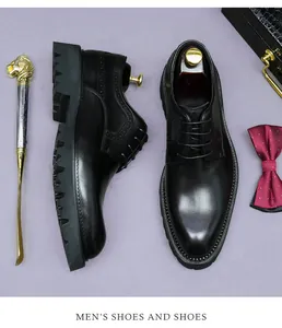 Detail of black leather Derby shoes with brogue carvings and thick non-slip rubber sole