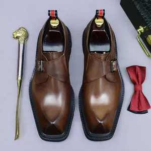 Brown leather monk strap business shoes with platform sole and gradient finish