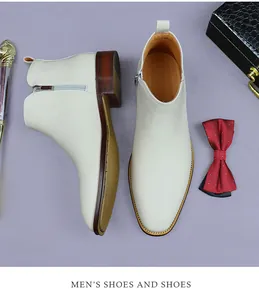 Close-up of beige leather Chelsea boots with side zipper and wood-grain rubber soles