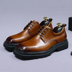 Men's brown leather dress shoes with square toe and thick rubber sole in a side view