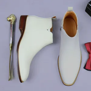 Polished off-white leather Chelsea boots for men with side zipper and wooden textured sole