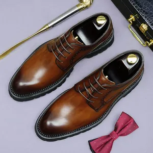 Deep brown leather Derby shoes with brogue detailing on a classic business backdrop