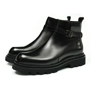Bottines Chelsea en cuir noir avec semelle plateforme et détail de boucle latérale