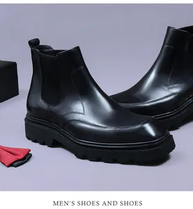 Macro detail of men's leather Chelsea boots with elastic side band and thick rubber sole