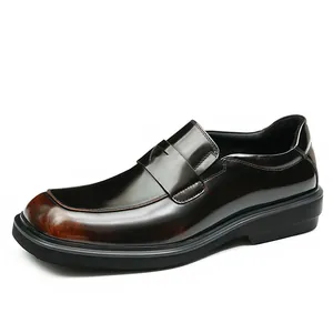 Formal men's leather loafers in polished black and brown gradient with thick rubber soles