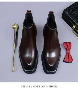 Detailed top view of dark brown leather Chelsea boots with square toe and thick black sole