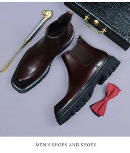 Top view of dark brown leather Chelsea boots with thick sole and elastic side panel