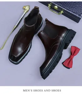 Detail of dark brown leather Chelsea boots with elastic sides and thick rubber sole