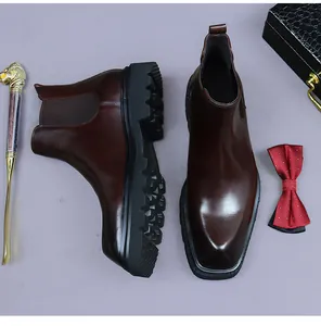 Close-up of premium dark brown leather chelsea boot with elastic side and lug sole