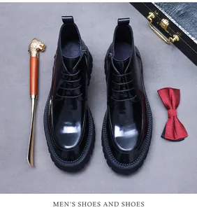 Detail of glossy black leather men boots with thick anti-slip sole and side zipper