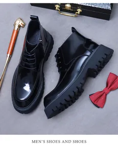 Detail of black leather boots with thick non-slip soles and side zipper closures