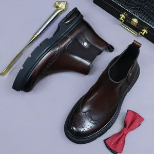 Brown leather Chelsea boots for men with brogue carving and thick rubber soles