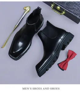 Macro shot of high-shine leather Chelsea boot with elastic side and thick gear-pattern sole