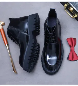 Polished black leather boots with thick rubber soles and side zipper details