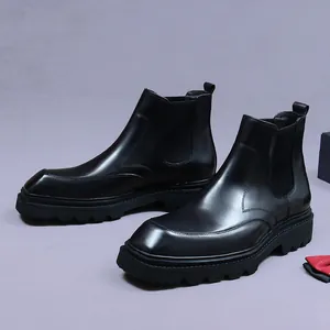 Mens black leather Chelsea boots with thick platform soles and square toe design
