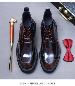 Detailed view of polished dark brown leather high-top boots with side zipper and laces