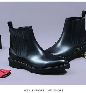 Macro detail of men's black leather Chelsea boots with elastic band and platform sole