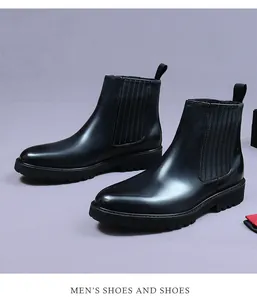 Macro detail of black leather Chelsea boot with elastic side panel and thick lug sole