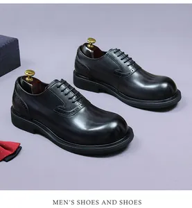 Macro detail of men's black leather brogue shoes featuring exquisite carved patterns