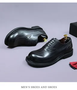 Classic black Brogue leather shoes with elegant wooden shoe tree and formal bowtie