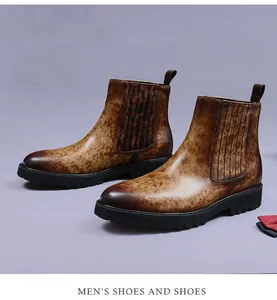 Detail of brown cow leather Chelsea boots with distressed texture and thick rubber sole