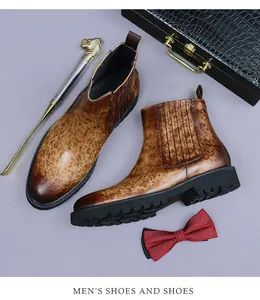 Detail of brown leather Chelsea boot with distressed texture and thick non-slip sole