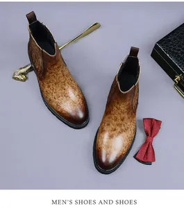 Top view of premium brown leather Chelsea boots with elegant British style accessories